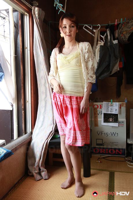 Asian Chika Sasaki strips to show round boobs and hairy love box.