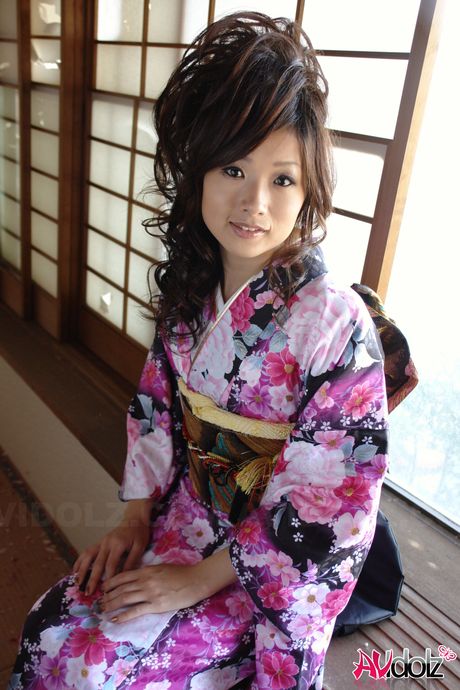 Asian teen Chiaki strips and shows her hairy pussy in a solo