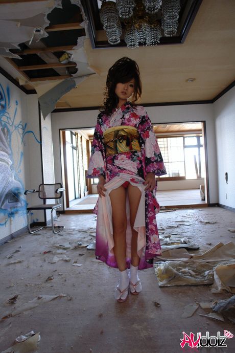 Perfect Asian babe Chiaki strips and shows her hairy pussy in a solo