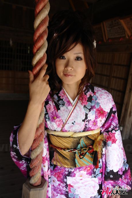 Hot Asian teen Chiaki strips and shows her tiny tits and pink pussy