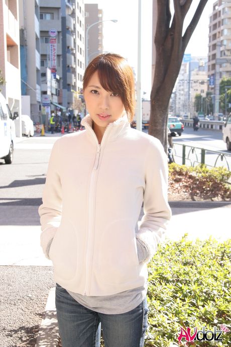 Platinum Japanese babe Mika Ito strips and shows her tiny tits and ass