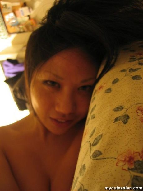 Japanese teen amateur strips and reveals her tiny tits and pussy