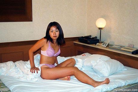 Stunning Asian wife with small tits and a sexy booty strips and reveals her naked form
