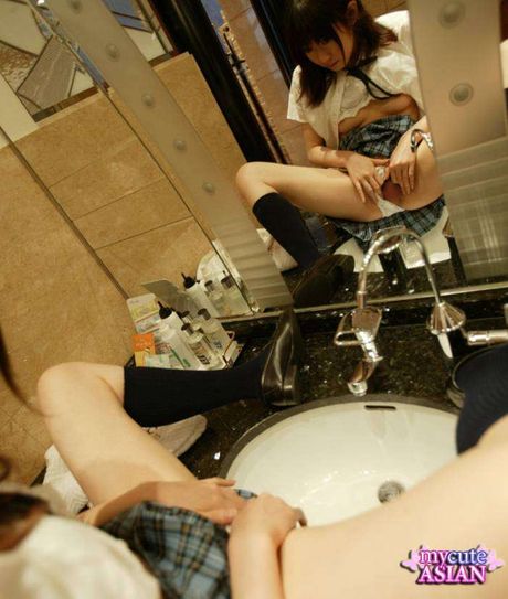 Amateur schoolgirl with tiny tits strips and shows her hairy pussy