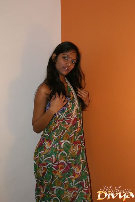 Amazing Indian teen Divya Yogesh strips and shows her tiny tits and pussy