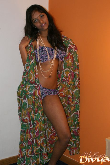 Amazing Indian teen Divya Yogesh strips and shows her tiny tits and pussy