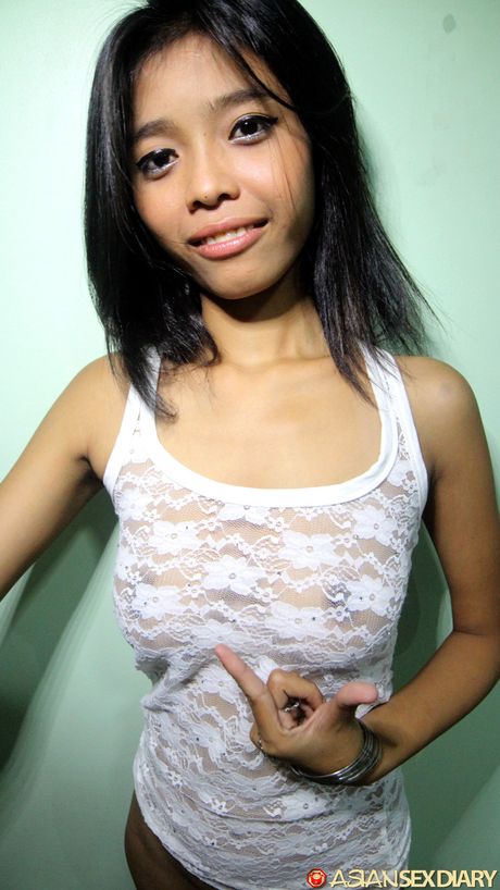 Amateur Asian girl strips and fucks a dildo in a solo masturbation scene