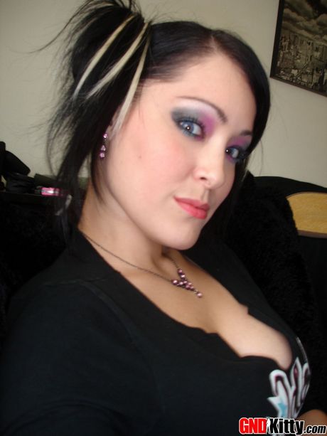 Asian teen Kitty strips and shows her amazing melons and ass in a solo