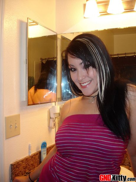 Asian teen Kitty unveils her big tits and fingers her horny pussy