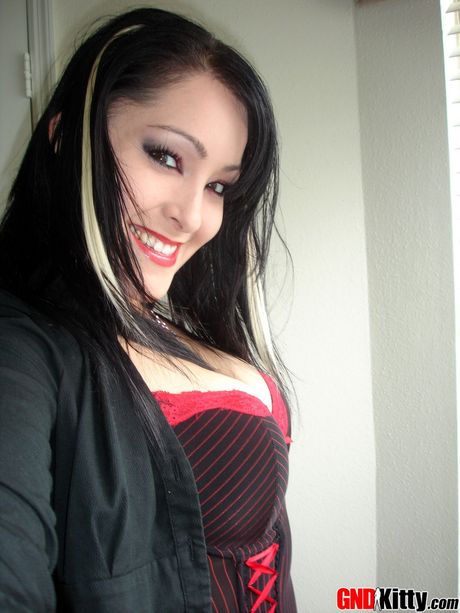 Asian teen Kitty strips and shows her hot booty and tits in a solo