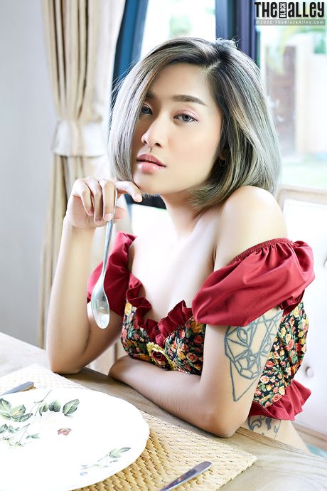 Asian teen Apple strips and reveals her hairy pussy up close