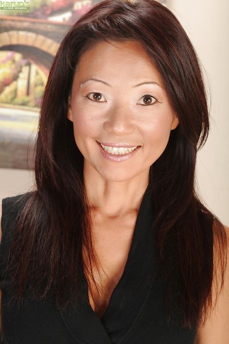 Inviting japanese milf Natsuko Kurosawa revealing big boobies and spreading her legs