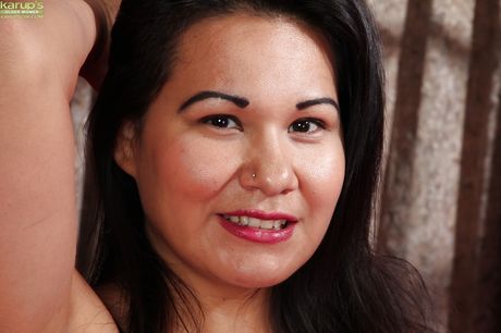 Delightful oriental mature Susie Jhonson in hose exposing small tits and toying