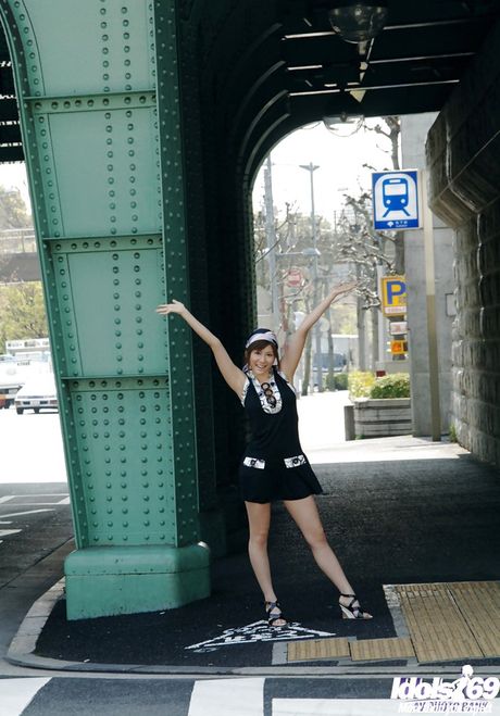 Enchanting japanese babe Yuma Asami in fancy skirt exhibiting big knockers and sexy ass outdoor