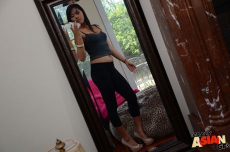 Attractive american milf Angelina Chung in hot undies reveals her ass and shaved pussy