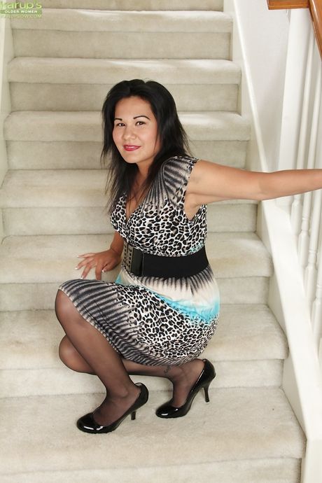 Gracile oriental mature Susie Jhonson baring big tits and pussy