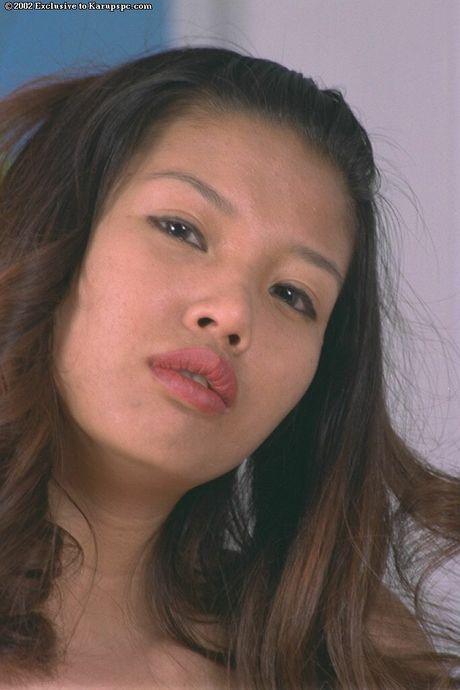 Stunning oriental dark hair youthful Niha baring her butt and spreading her legs