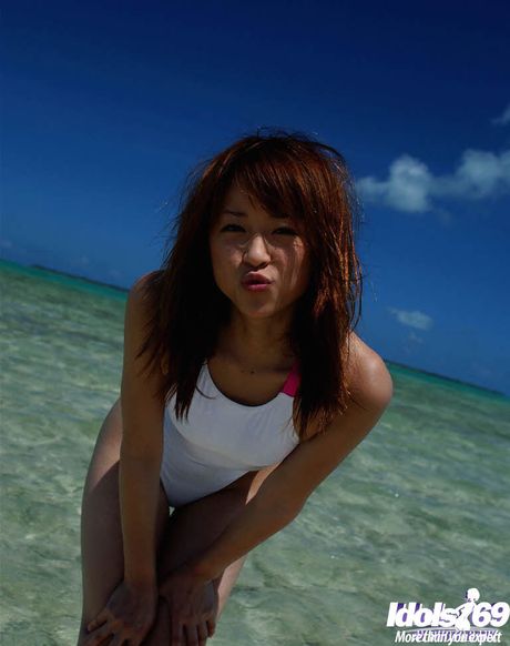 Slender japanese young Asuka Kyono in hot bikini shows small tits and hot ass at beach