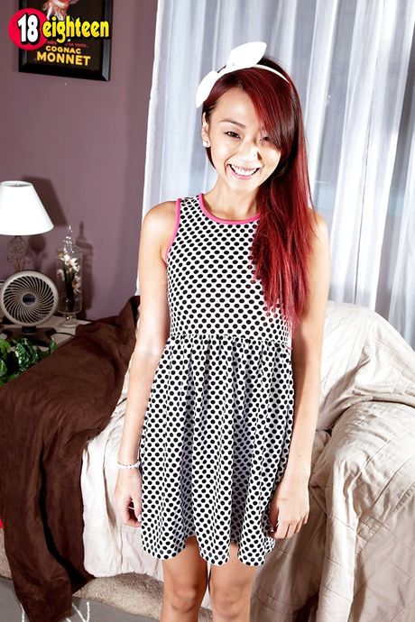 Slender asian redhead young Layla Mynxxx in fancy skirt reveals small tits and butt
