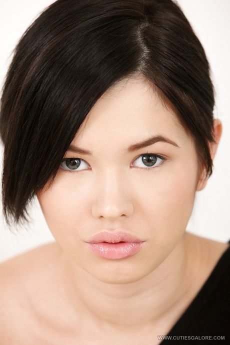 Slim asian brunette teen Netta bares small tits and masturbates with sex toy